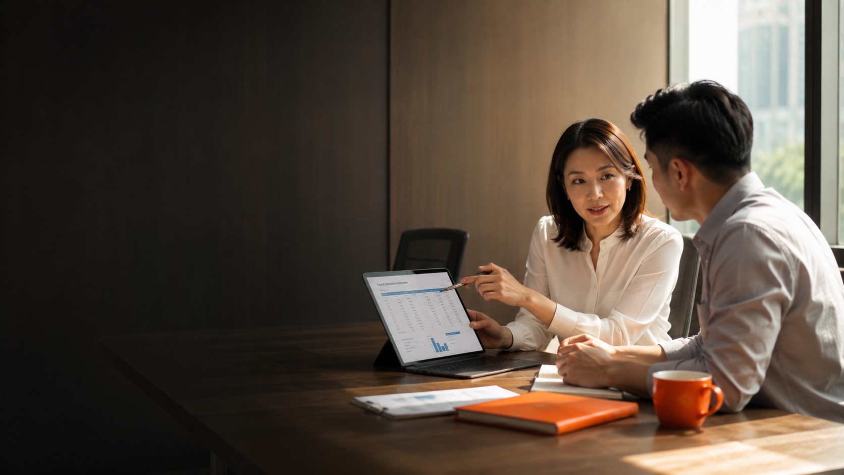 Payroll Outsourcing Singapore — People Profilers payroll consultant reviewing monthly payslip report and statutory contributions with client